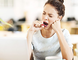 A woman yawns.